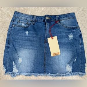 CUTE NEVER WORN TAGS ATTACHED DENIM SKIRT WITH RIPS